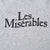 Close-up of black Les Misérables logo printed on sweatshirt back