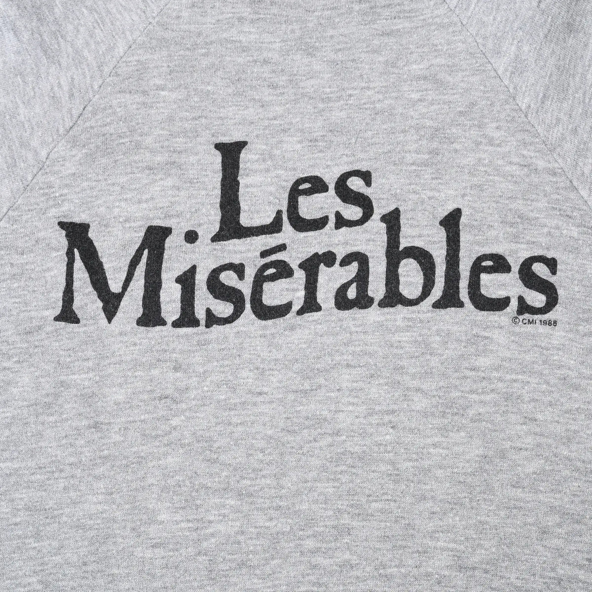 Close-up of black Les Misérables logo printed on sweatshirt back