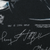 Close-up of 1994 NFL licensing text and printed player signatures
