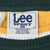 Close-up of Lee Sport XL neck label and green, yellow, and white ribbed collar