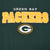Close-up of embroidered Green Bay Packers lettering and G logo on green sweatshirt