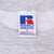 Close-up of Russell Athletic size L neck label inside gray sweatshirt