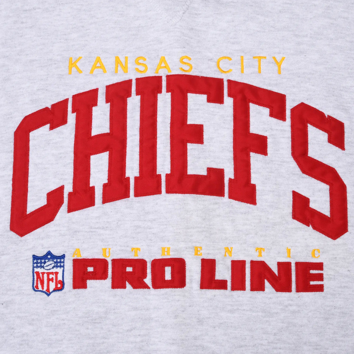 Close-up of red and gold Kansas City Chiefs NFL Pro Line embroidered chest graphic