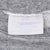 Close-up of faded neck label and stitching inside gray Disney sweatshirt