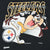 Close-up of Pittsburgh Steelers Taz football graphic on black sweatshirt