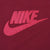 Close-up of red Nike spellout and Swoosh applique on burgundy sweatshirt