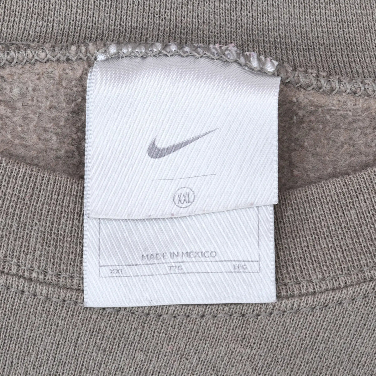 Nike neck tag showing Swoosh logo and XXL size inside khaki sweatshirt