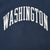 Close-up of arched white Washington print on navy sweatshirt fabric