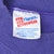Close-up of Hanes Activewear neck label inside the purple sweatshirt
