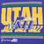 Close-up of yellow, green and white Utah Jazz front graphic on purple fabric