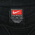 Close-up of Nike Team XL neck label inside black Missouri sweatshirt