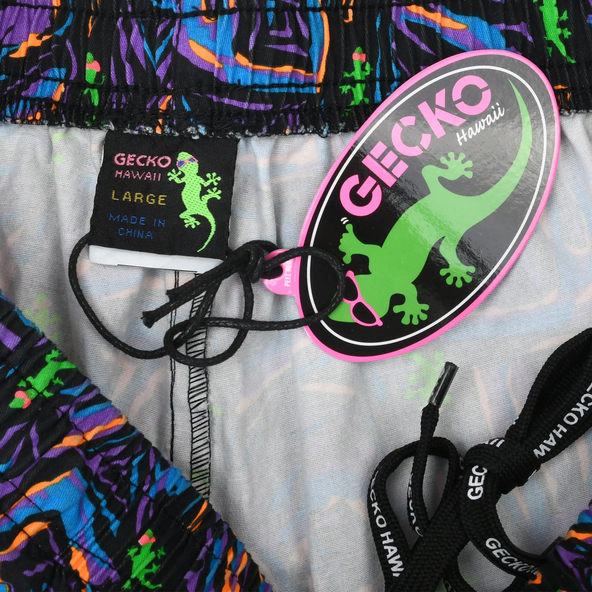 Gecko Hawaii pants interior showing Large label, gecko hangtag and black drawstring