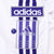 Adidas patches, purple three-stripe trim, and branded side snap button detail