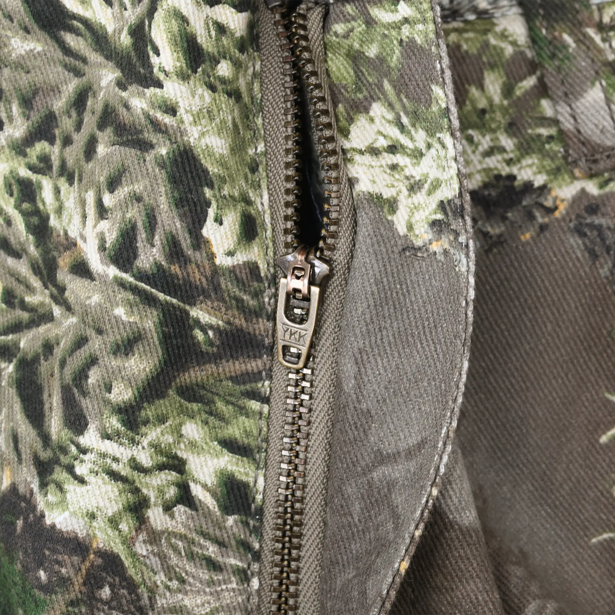 Close-up of metal YKK fly zipper on Realtree Max-1 camo pants