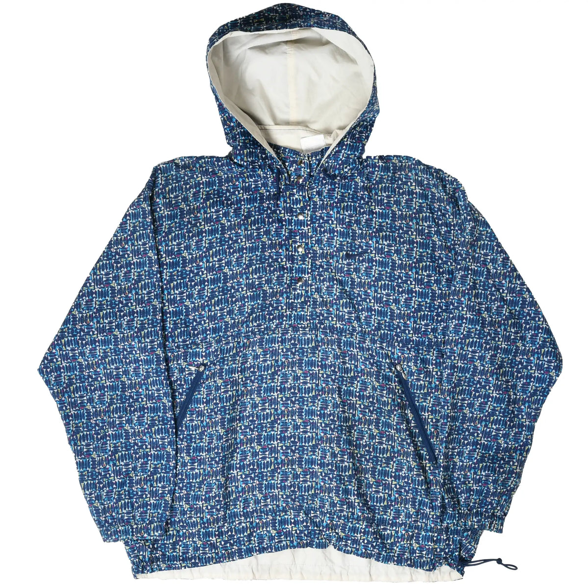 Front of Nike blue patterned hooded pullover jacket with white lining visible below the hem