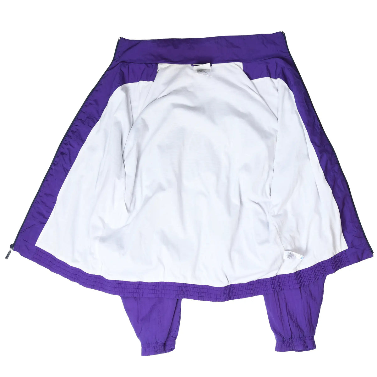 Open Adidas windbreaker showing white interior lining, purple trim, and elastic cuffs