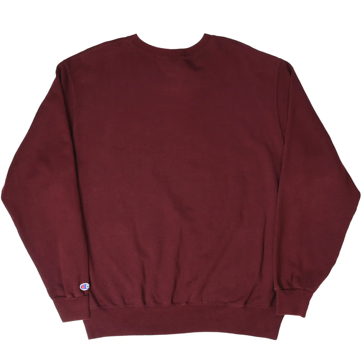 Back of burgundy Champion crewneck sweatshirt with small logo patch near the lower left hem
