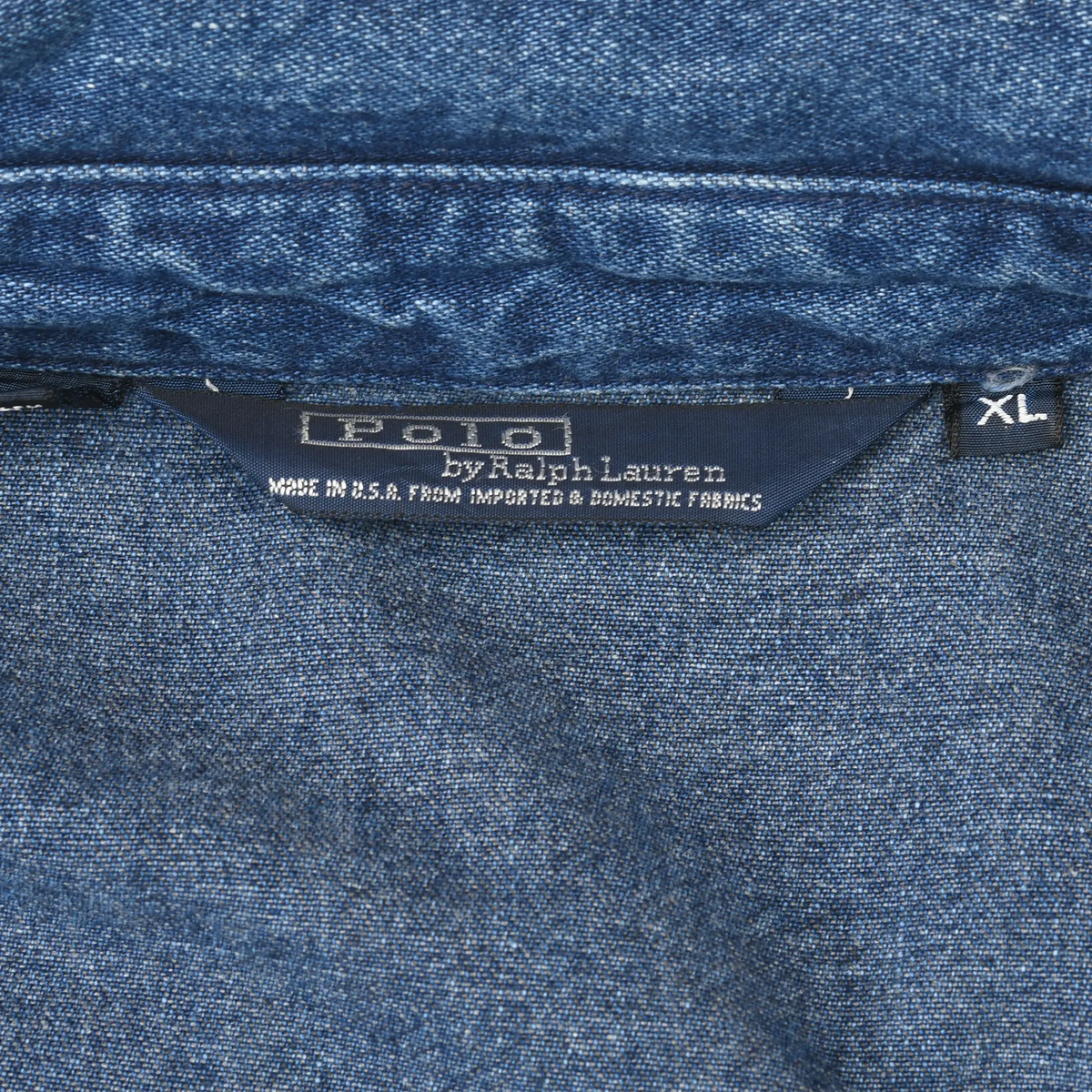 Polo by Ralph Lauren neck label and XL size tag inside blue denim jacket