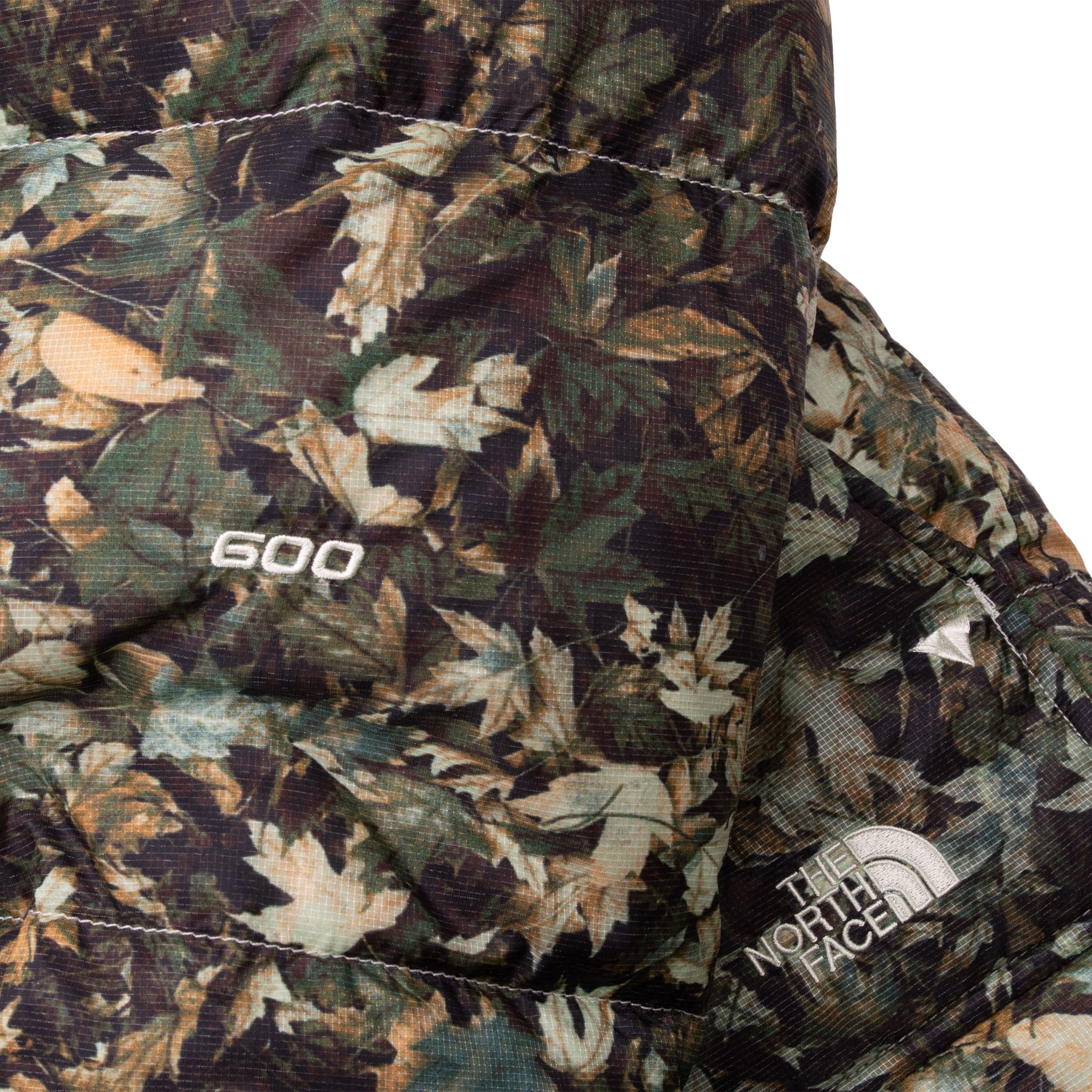 The Moment You See The Oversized Baffles You Know You're Looking At The Iconic Nuptse Jacket. This Durable Piece Has Lofty 600-Fill Down And A Sleek, Stowable Hood. Vintage The North Face 600 Nuptse Camo Leaf Down Jacket Size Medium