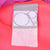 Close-up of Ocean Pacific neck label inside the pink pullover jacket