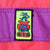 Close-up of colorful Xtreme Air embroidered patch on purple jacket band