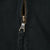 Close-up of metal front zipper and fabric pull on black Polo Ralph Lauren jacket