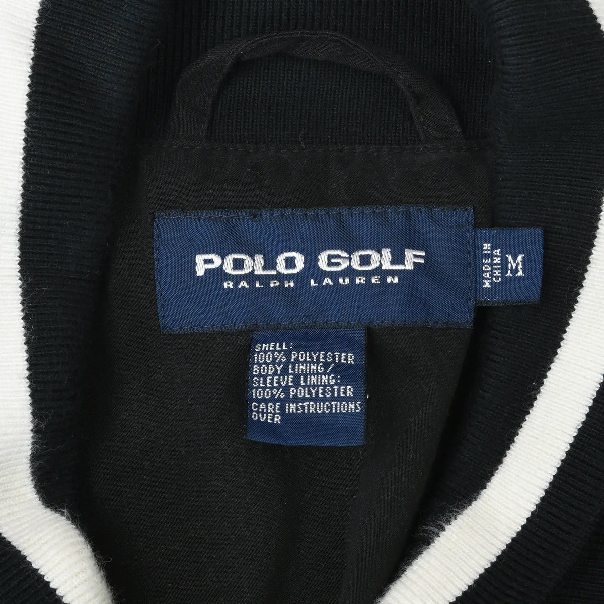 Polo Golf Ralph Lauren neck label and medium size tag inside black pullover jacket