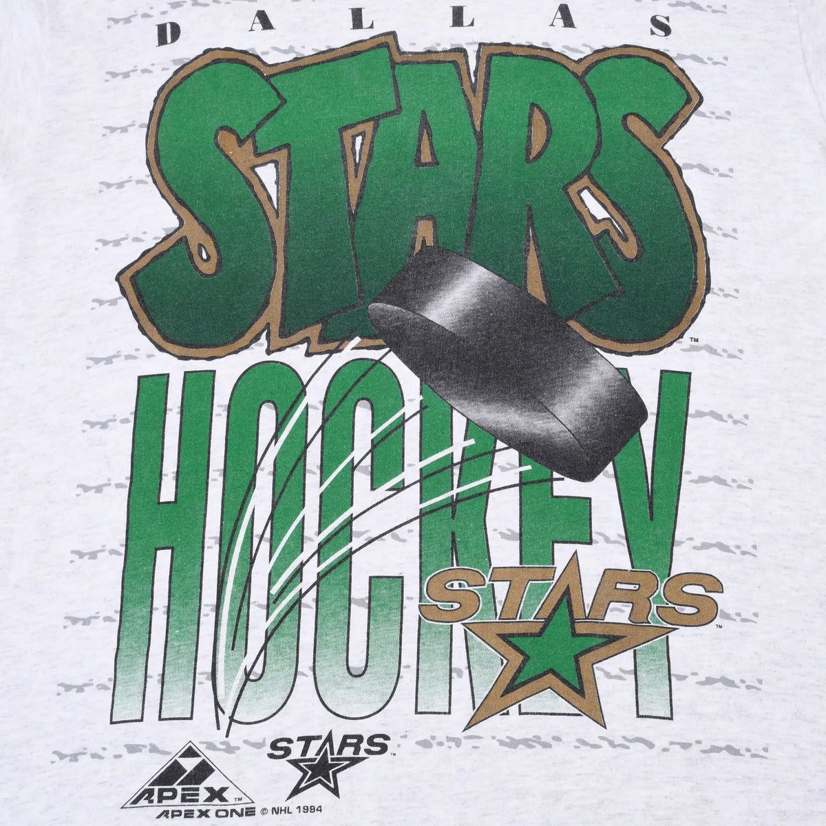 Close-up of green and gold Dallas Stars hockey graphic with puck