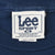 Close-up of Lee Sport XL neck tag inside navy Michigan T-shirt