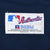 Close-up of MLB Russell Athletic Collection garment label on navy jersey fabric
