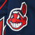Close-up of embroidered Cleveland Indians Chief Wahoo logo patch on navy fabric
