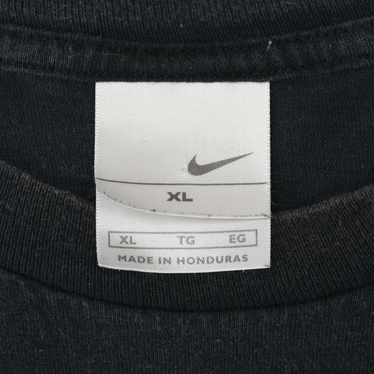 Close-up of Nike neck tag marked XL and made in Honduras