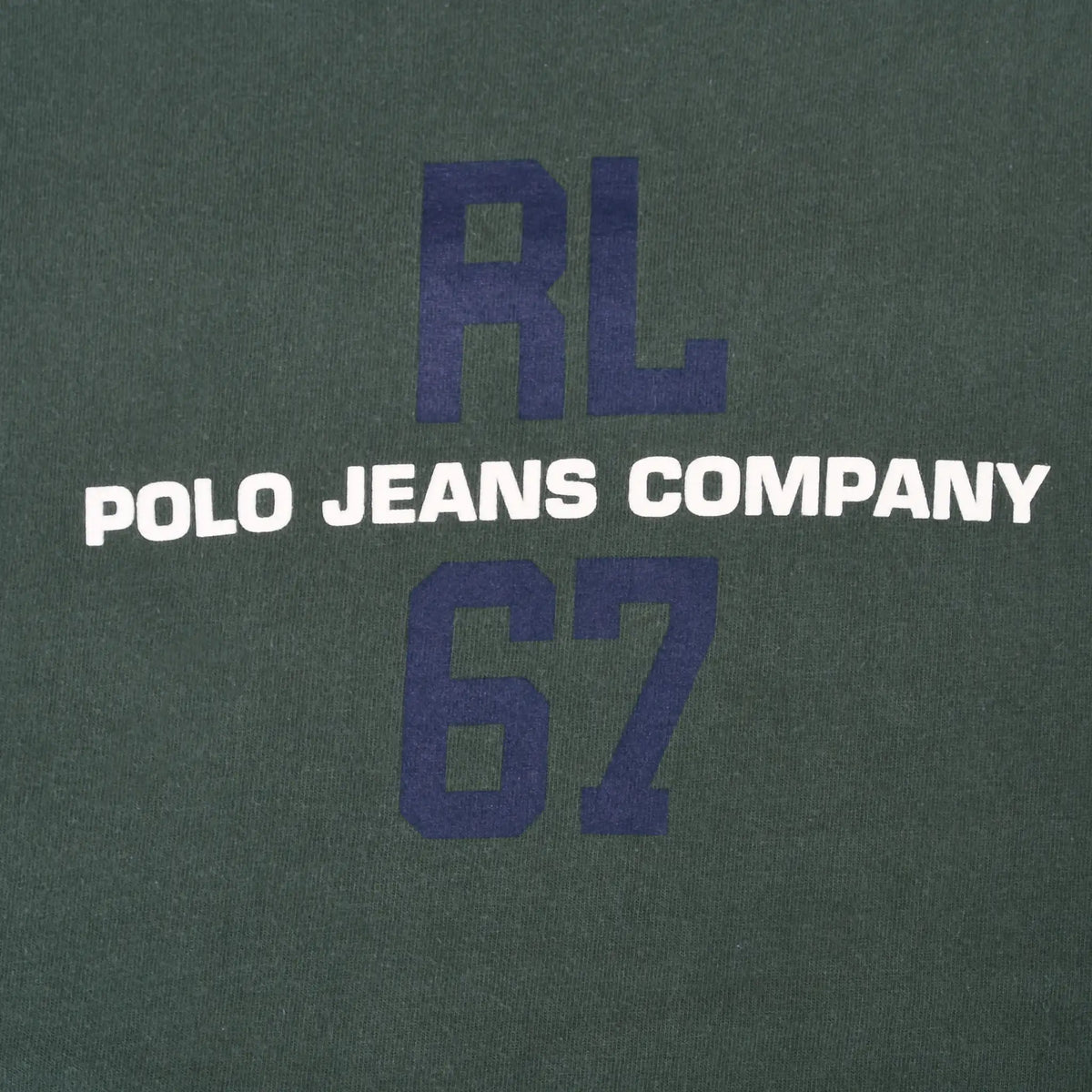 Close-up of navy RL 67 and white Polo Jeans Company chest print on green fabric