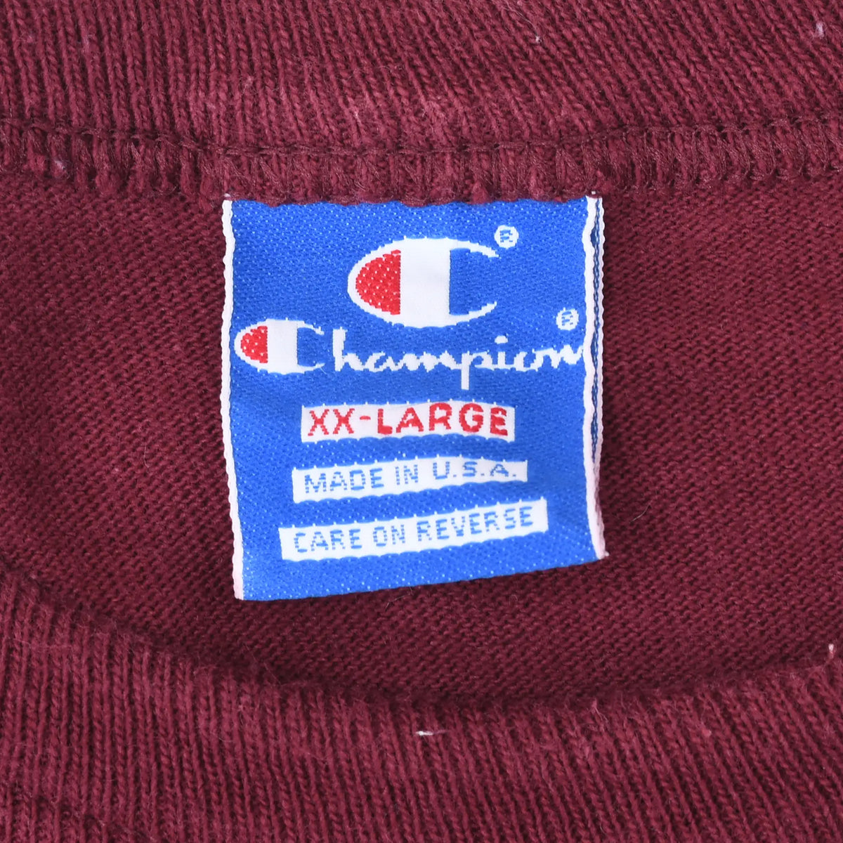 Champion XX-Large Made in USA neck label on maroon T-shirt