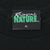 Close-up of Tropical Nature XL neck label on black T-shirt