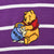 Close-up of embroidered Winnie the Pooh holding a blue honey pot on purple striped fabric