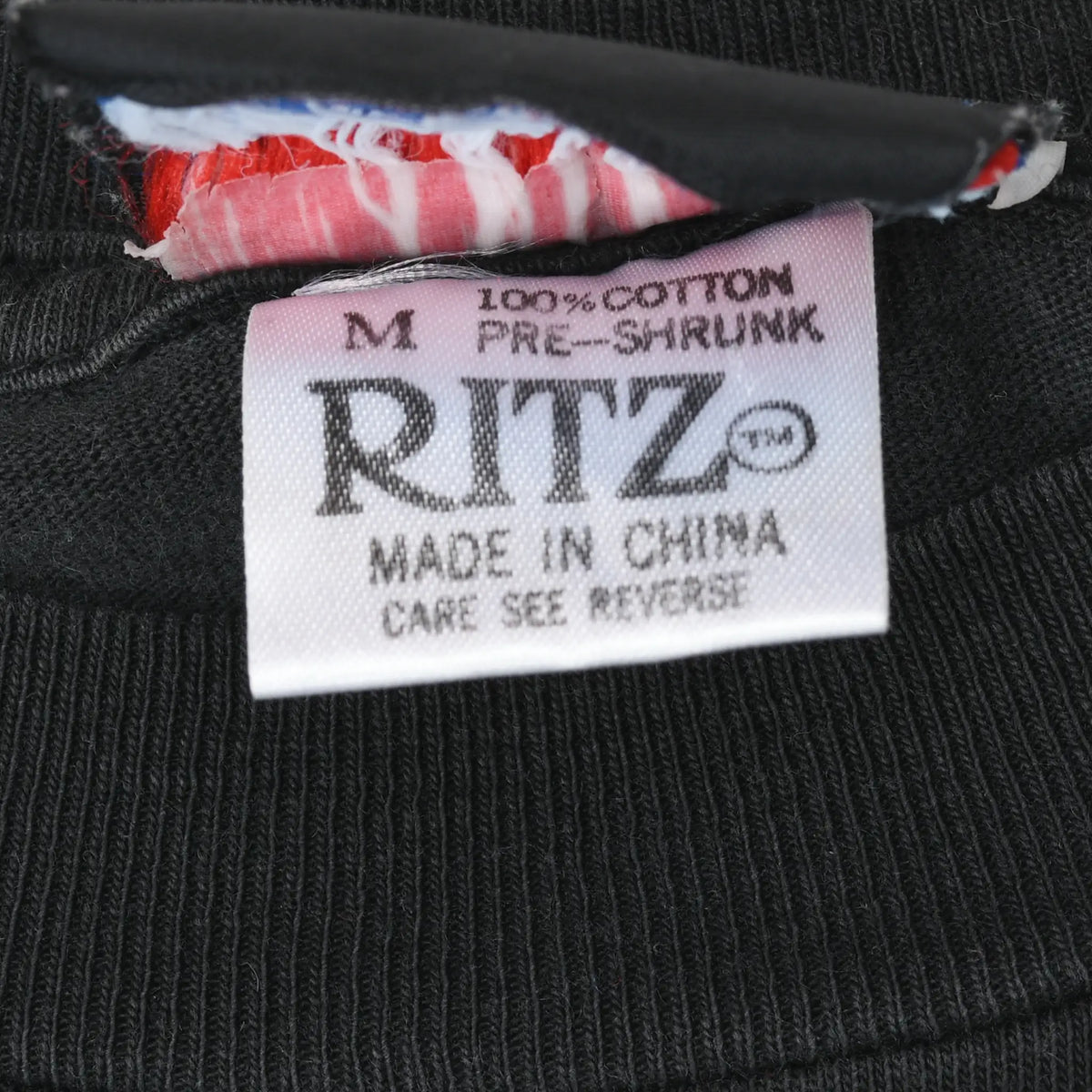 Ritz size M care label stating 100% cotton, pre-shrunk and made in China