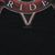 Close-up of black shirt fabric and lower edge of the embroidered-style Ride banner graphic