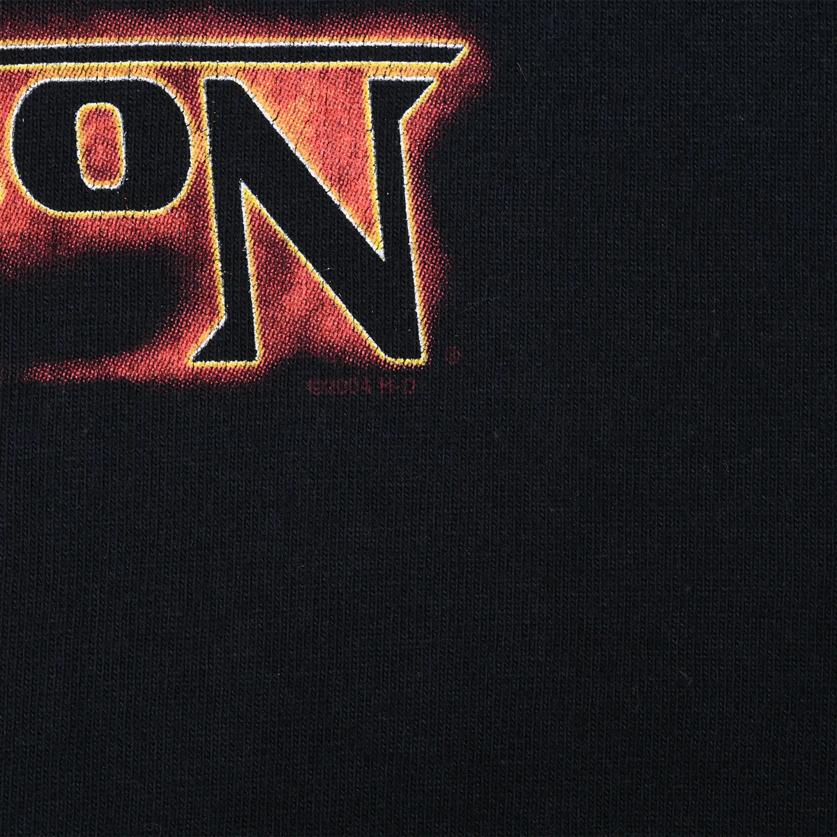 Close-up of front print edge showing small 2004 H-D copyright mark