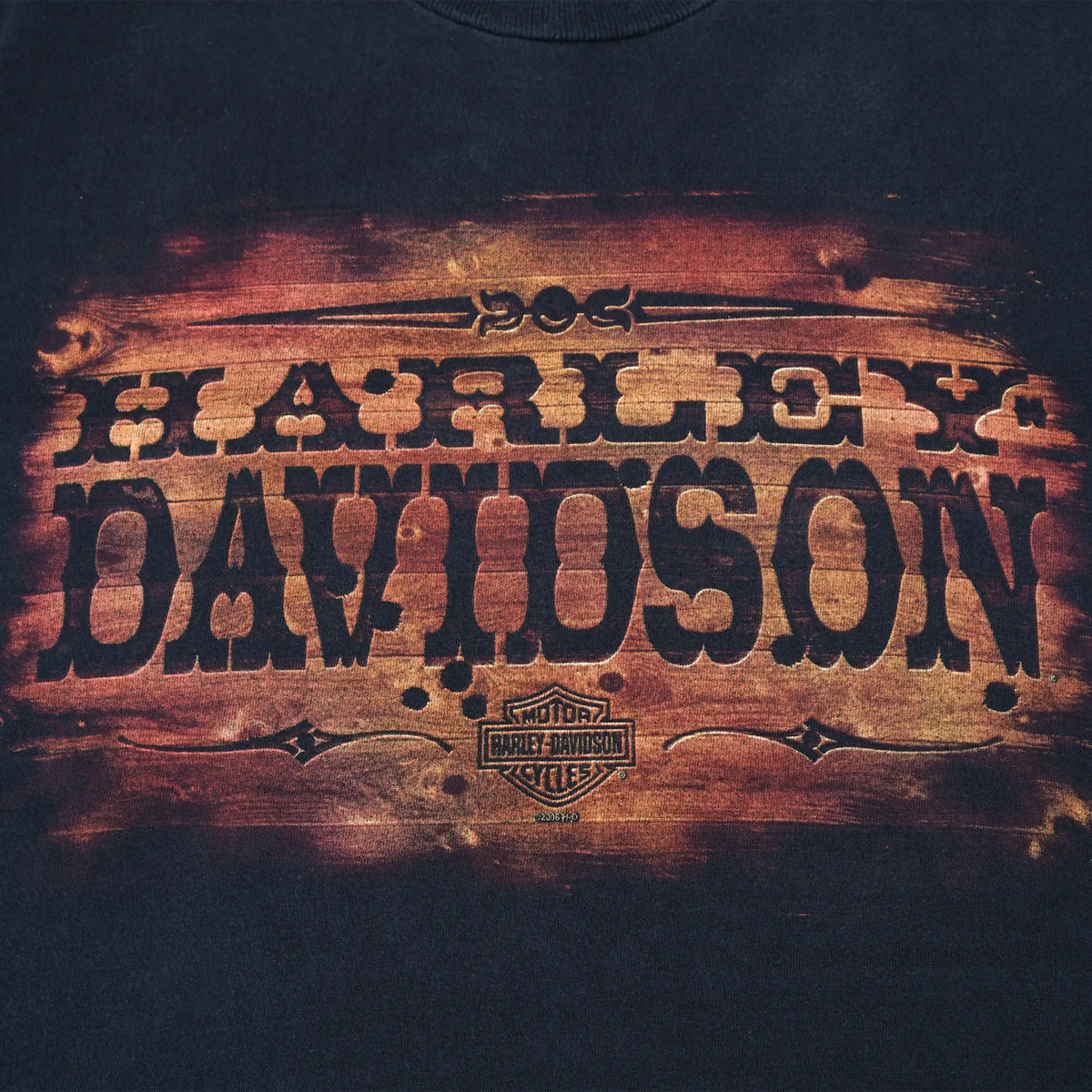 Front print detail showing distressed orange and black Harley-Davidson graphic