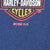 Close-up of Harley-Davidson logo and ©1999 H-D print on blue fabric