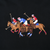 Close-up of multicolor polo players and horses embroidered on black fabric