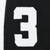Close-up of white embroidered number 3 patch on black hoodie sleeve