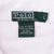 Close-up of green Polo by Ralph Lauren neck, size and care labels inside white collar