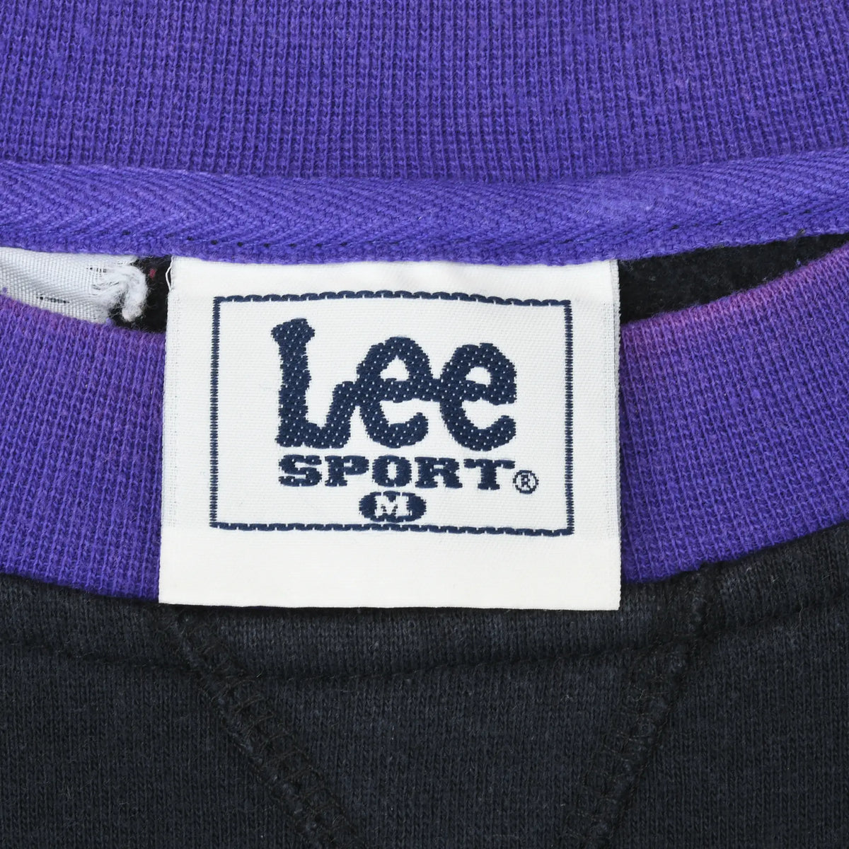 Lee Sport medium neck label beneath the purple sweatshirt collar