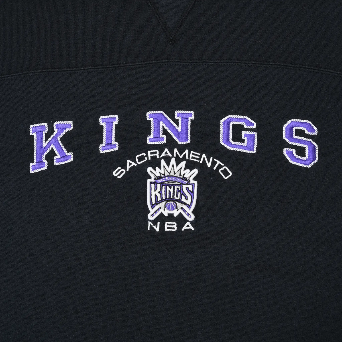 Close-up of purple and white embroidered Sacramento Kings NBA chest logo