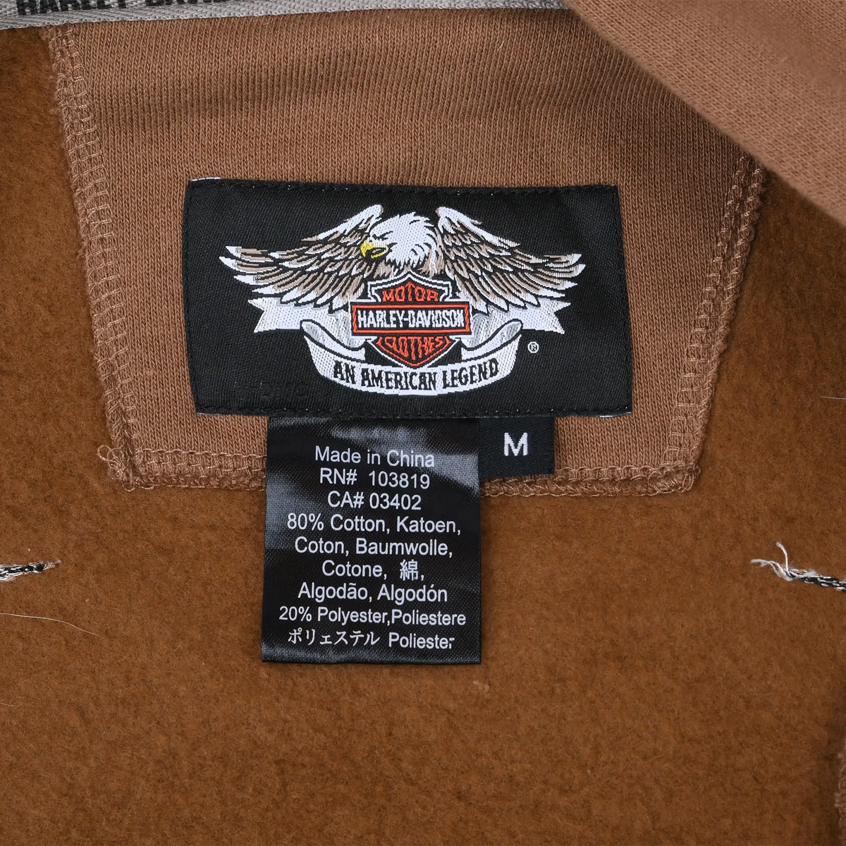 Harley-Davidson American Legend neck label and medium size care tag inside brown hoodie