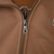 Close-up of Harley-Davidson branded metal zipper pull on brown hoodie