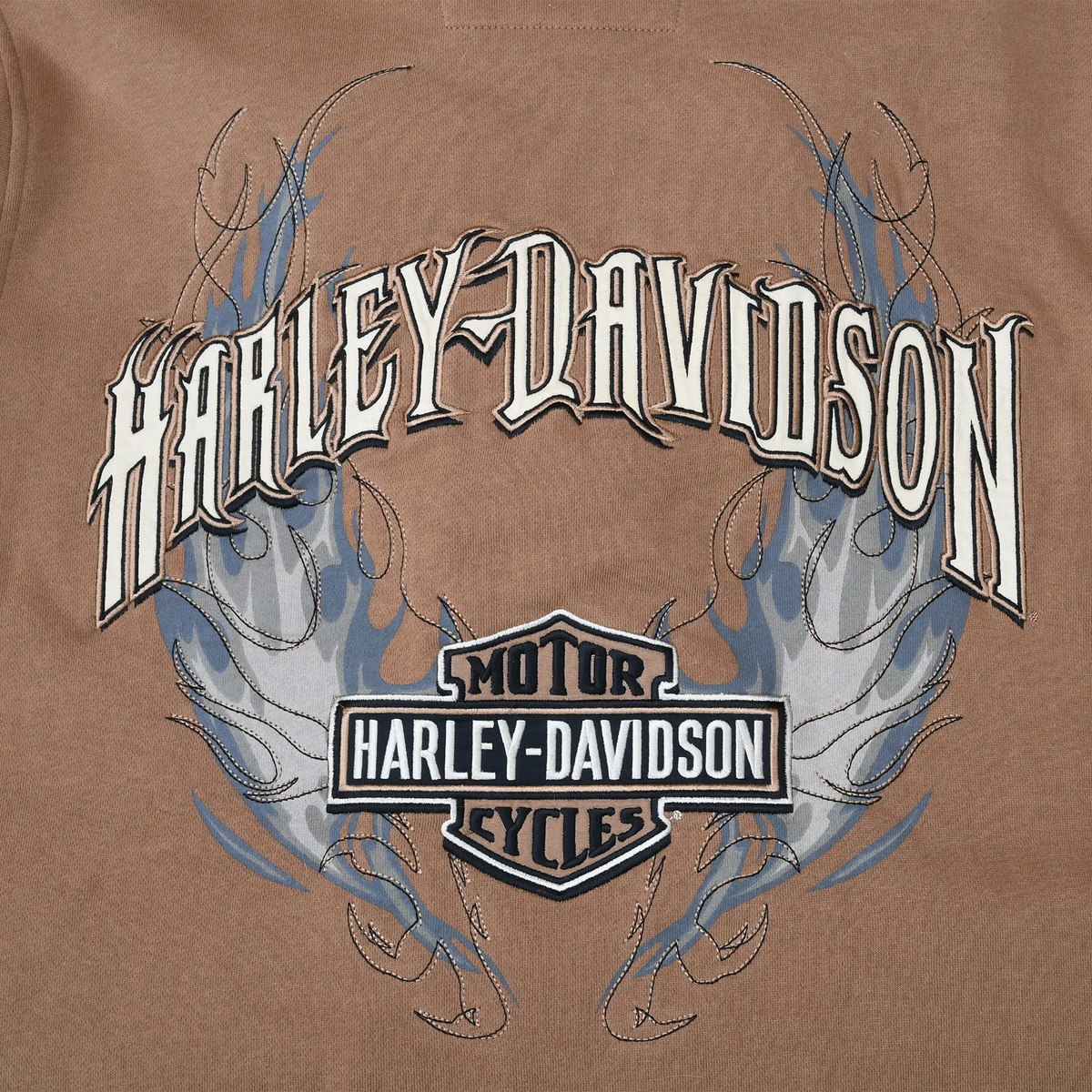 Close-up of large Harley-Davidson back embroidery with blue and gray flame details