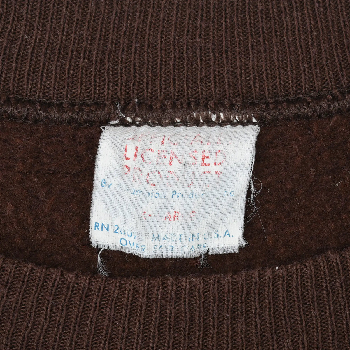 Close-up of faded Jerzees sweatshirt neck label